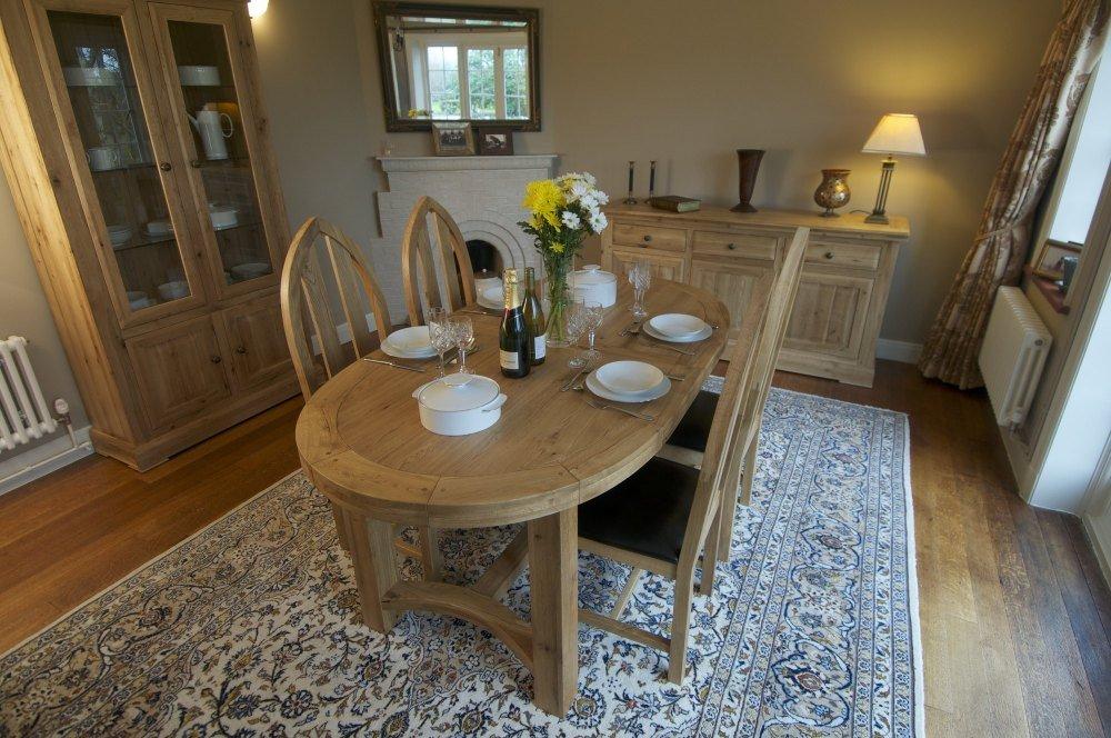Oval timber dining table online